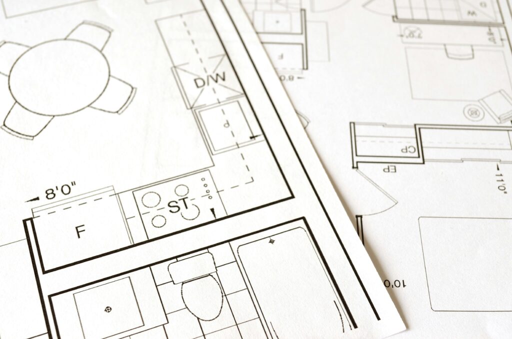 pexels-photo-271667-271667 Close-up view of an architectural floor plan on paper showcasing detailed room layouts and measurements.